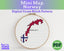 Cross stitch pattern of Norway's flag in an embroidery hoop with 'Lost in Cross Stitch' branding.
