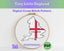 Cross stitch pattern of England with a red cross on a white background, framed in an embroidery hoop.