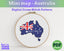 Cross stitch pattern of Australia with the Australian flag, framed in a hoop on a white background.