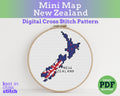 Cross stitch pattern of New Zealand with embroidery hoop on a white background