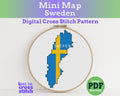Cross stitch pattern of Sweden's flag in an embroidery hoop 