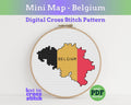 Digital cross stitch pattern of Belgium's flag in an embroidery hoop on a white background.